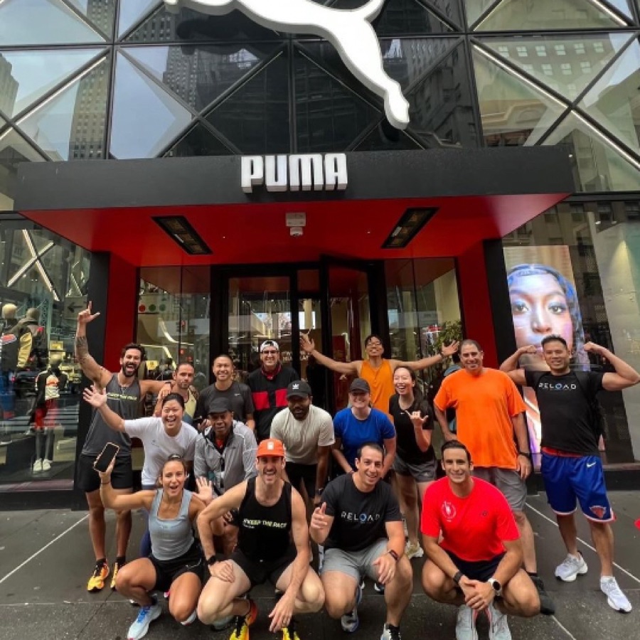 KTP group run crew celebrating outside the PUMA store in midtown Manhattan